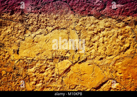 Old cracked clay stone wall background or texture. Stock Photo