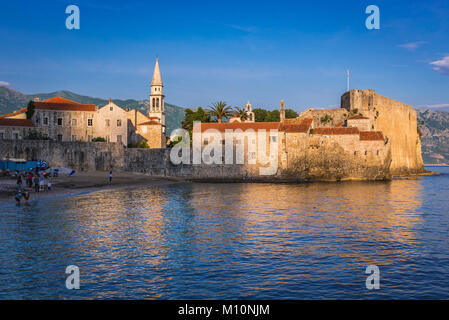 Old Town walls with bell tower of Saint John the Baptist cathedral in Budva city on the Adriatic Sea coast in Montenegro Stock Photo