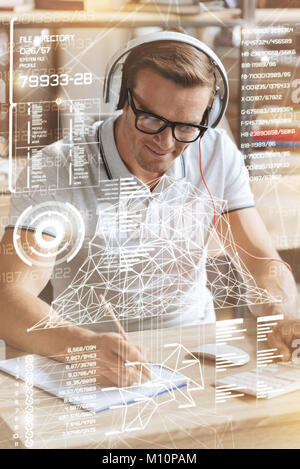 Professional software engineer making notes Stock Photo