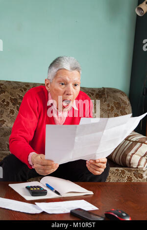 Shocking amount of bills an old lady has to pay for Stock Photo