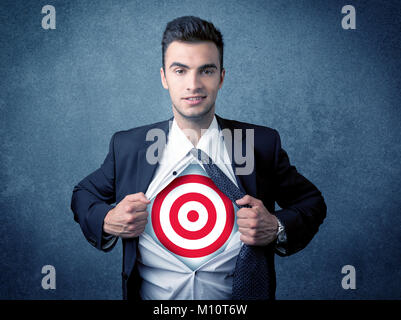 Businessman tearing his shirt off with target sign symbol on his chest concept on background Stock Photo