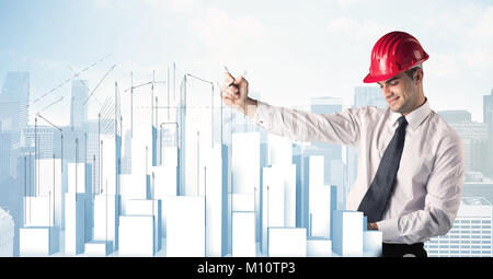 A happy construction worker drawing a city with white, plain buildings, using arrows and angles Stock Photo