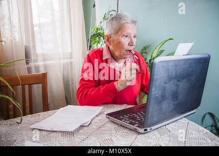Shocking amount of money an old woman has to pay for her bills Stock Photo