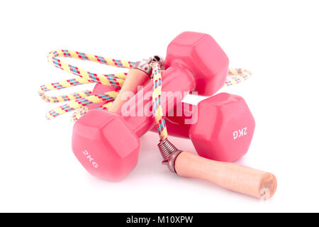 Two plastic coated dumbells and skipping rope isolated on white background. Stock Photo