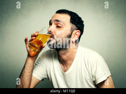 Funny sport fan drinking beer Stock Photo