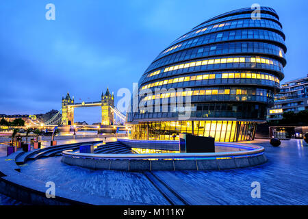 LONDON, ENGLAND - JULY 25 2017: The London City Hall and Tower Bridge in the blue morning light, London, England, UK Stock Photo