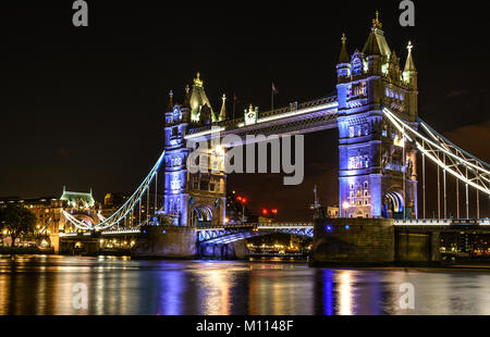 Tower Bridge is a famous icon of London, England that was built in 1894 on river Thames. Each tower reaches a height of 65 meters. Stock Photo