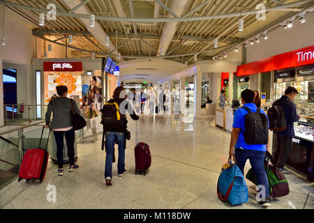 Inside Athens international airport, Greece. Hallway to flight boarding gates with shops along the way Stock Photo