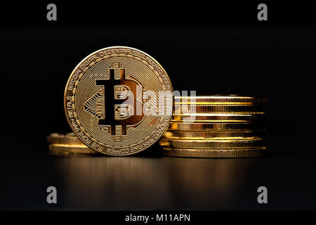crypto currency bitcoin golden representation on black background Stock Photo