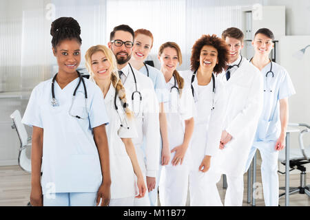 Portrait Of Confident Smiling Multi Ethnic Male And Female Doctors In Clinic Stock Photo