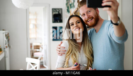 Pretty loving couple is making selfie Stock Photo