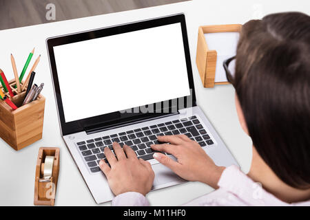 Close-up Of A Businesswoman Working On Laptop In Office Stock Photo