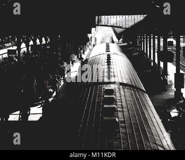 Busy Railway Station in Colombo - the Capital of Sri Lanka. Black and White Photography with a lot of Unrecognizable People and the Roof of the Train. Stock Photo