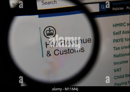 HM Revenue & Customs website seen through a magnifying glass Stock Photo