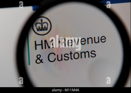 HM Revenue & Customs website seen through a magnifying glass Stock Photo