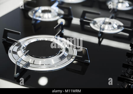 Modern gas stove burner made of shiny stainless steel and black ceramics Stock Photo