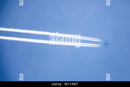 Contrails in the sky over the North Sea island Norderney, Germany, caused by the exhaust gases of jet planes at high altitude, Stock Photo