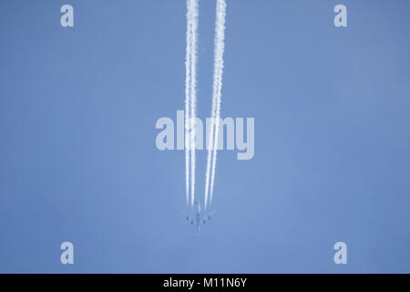 Contrails in the sky over the North Sea island Norderney, Germany, caused by the exhaust gases of jet planes at high altitude, Stock Photo