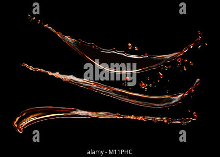 Coffee splash collection isolated on a black background. Liquid high-speed photography. Food in motion. Stock Photo