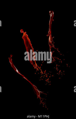 Hot chocolate splash collection isolated on a black background. Liquid high-speed photography. Food in motion. Stock Photo