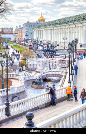 MOSCOW, RUSSIA - April 24.2016: People walk past the Alexander Garden fountains in the historic center of city Stock Photo