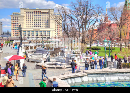 MOSCOW, RUSSIA - April 24.2016: People walk past the Alexander Garden fountains in the historic center of city Stock Photo