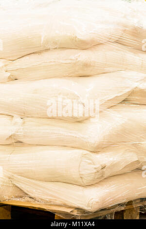 A bunch of large bags on a pallet Stock Photo