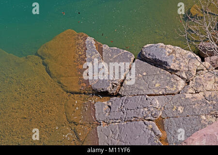 Colorful Rocks and Water in the Sun in Johnsons Shut-ins State Park in Missouri Stock Photo