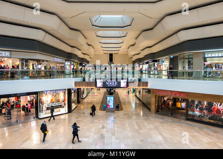 Inside a quiet Queensgate Shopping Centre, with people on the ground floor and first floor. Peterborough city, Cambridgeshire, England, UK. Stock Photo