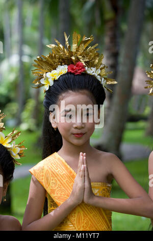 Indonesia. Sambirenteng. Island Bali. Young traditionnal Bali dancer holding palms together, smiling, portrait Stock Photo