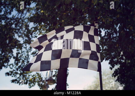 Black and white chequered flag denoting the start or finish of a race Stock Photo