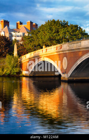 Harvard University bridge on the Charles River in Cambridge, Massachusetts. Beautiful early morning light with reflections. Vertical Stock Photo