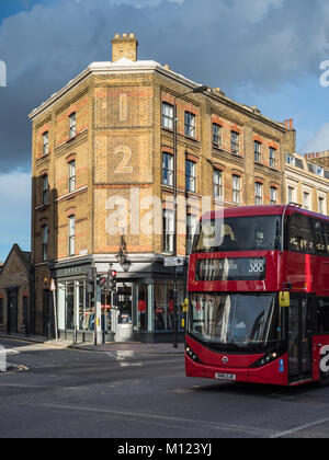 Bethnal Green Road East London, a bus drives down Bethnal Green Rd in the Shoreditch area of fashionable East London near Brick Lane Stock Photo