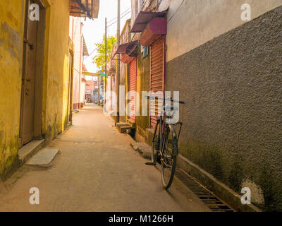 Bicycle parked in an alley of Cochin (Kochi), Kerala, India Stock Photo