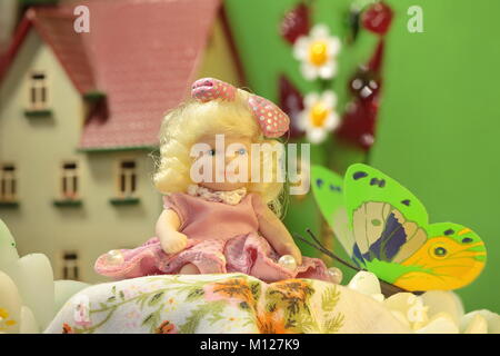 Thumbelina girl among the flowers in Puppet town Stock Photo