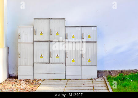 Electro-panel cabinets. Industrial equipment for high voltage electrical supply of civil and industrial objects. White electro-cab in front of a white Stock Photo