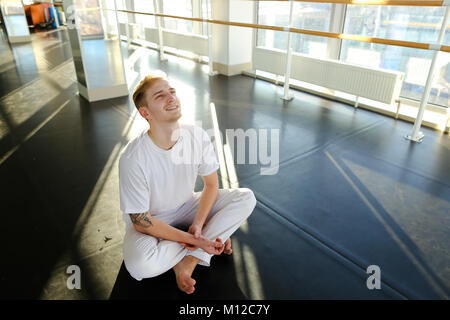 Guy doing drinking water before morning training.  Stock Photo