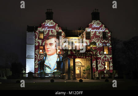 A portrait of Robert Burns is projected on to the front of Prestonfield House in Edinburgh on Burns Night. Stock Photo