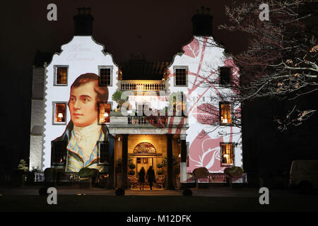 A portrait of Robert Burns is projected on to the front of Prestonfield House in Edinburgh on Burns Night. Stock Photo