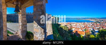 Old town of Nafplion in Greece view from above with tiled roofs, small port and bourtzi castle on the Mediterranean sea water Stock Photo