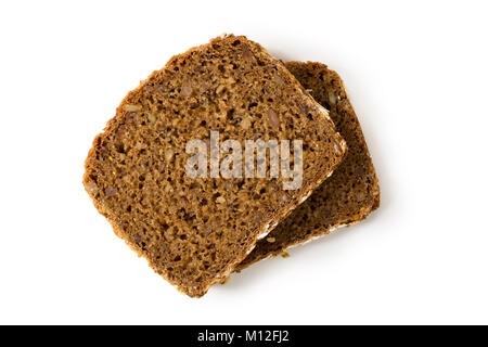 Bread whole grain two slices stacked over one another isolated on white background, top view, closeup Stock Photo