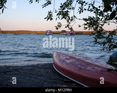 Red canoe on Great Slave Lake Stock Photo