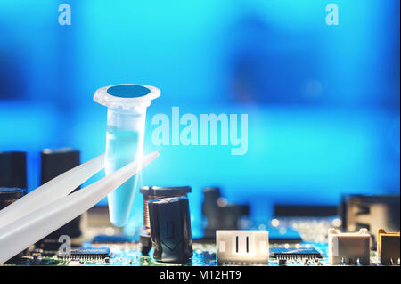 New technology concept. Scientific or chemical liquid sample on abstract technological background, space for your text. Stock Photo