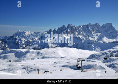 Ski paradise in the Italian Dolomites. Ski lift, piste, slopes in the Alps Stock Photo