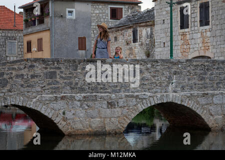 Old stone bridge in Vrboska on Hvar Island, Croatia Stock Photo