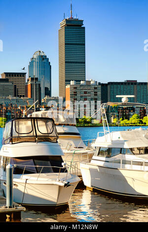 Boston skyline along the Charles River with pleasure boats anchored in the foreground. Sunny day with blue sky Stock Photo