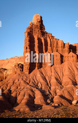 Chimney Rock, a dark red Moenkopi formation capped with white Shinarump sandstone in Capitol Reef National Park, Utah. Stock Photo