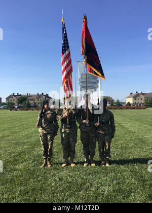 Pfc. Yaa Agyemang (far right), financial clerk 9th Financial Management Sustainment Unit, 1st Infantry Division, Sustainment Brigade, performs her duty as a rifleman of the Honor Guard during a change of command ceremony for Special Troops Battalion, Sustainment Brigade, on May 18, 2017 on Calvary Parade Field at Ft. Riley, KS. Agyemang was hand picked by the unit's Command Sgt. Maj. to perform the duty. Stock Photo