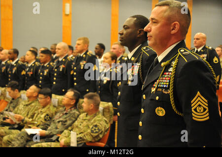 Command Sgt. Maj. Toby Kammer and Command Sgt. Maj. Craig Williams join fellow noncommissioned officers in reciting the Creed of the Noncommissioned Officer at the NCO  Induction ceremony. Stock Photo