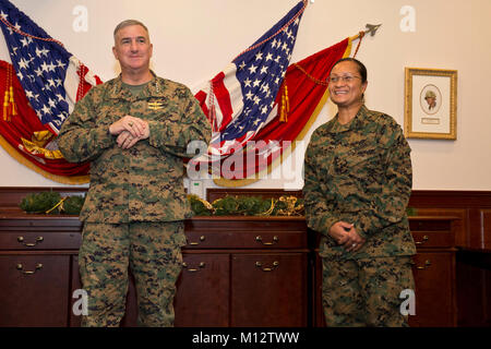The Assistant Commandant of the Marine Corps Gen. Glenn M. Walters, left, promotes Master Sgt. Elsy Rose Brazil, senior enlisted aide to the Assistant Commandant, at the Pentagon, Washington, D.C., Nov. 28, 2017. Brazil was pinned to the rank of Master Gunnery Sergeant by Gen. Joseph F. Dunford, 19th Chairman of the Joint Chiefs of Staff, and retired General John M. Paxton Jr., former Assistant Commandant of the Marine Corps, in her Military Occupational Specialty of Food Service. (U.S. Marine Corps Stock Photo